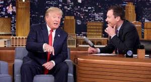 In this image released by NBC, Republican presidential candidate Donald Trump, left, appears with host Jimmy Fallon during a taping of "The Tonight Show Starring Jimmy Fallon," on Friday, Sept. 11, 2015, in New York. (Douglas Gorenstein/NBC via AP)